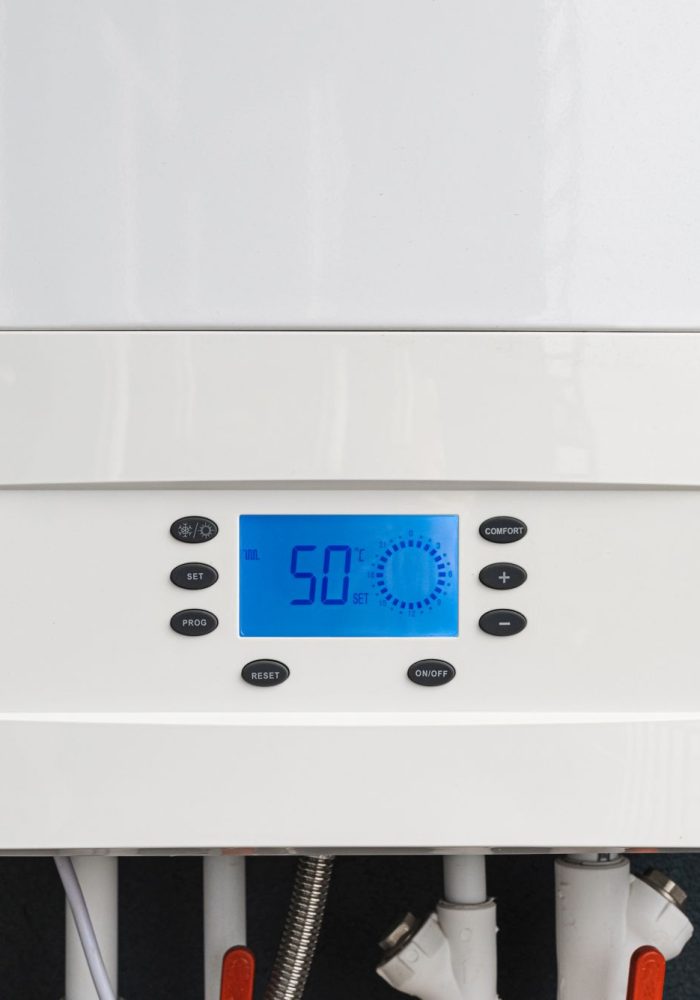 Close up of smart control panel of gas boiler for winter home heating and hot water. Modern house device.
